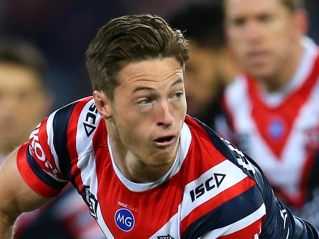 SYDNEY, AUSTRALIA - SEPTEMBER 28:  Sam Verrills of the Roosters offloads the ball during the NRL Preliminary Final match between the Sydney Roosters and the Melbourne Storm at the Sydney Cricket Ground on September 28, 2019 in Sydney, Australia. (Photo by Jason McCawley/Getty Images)