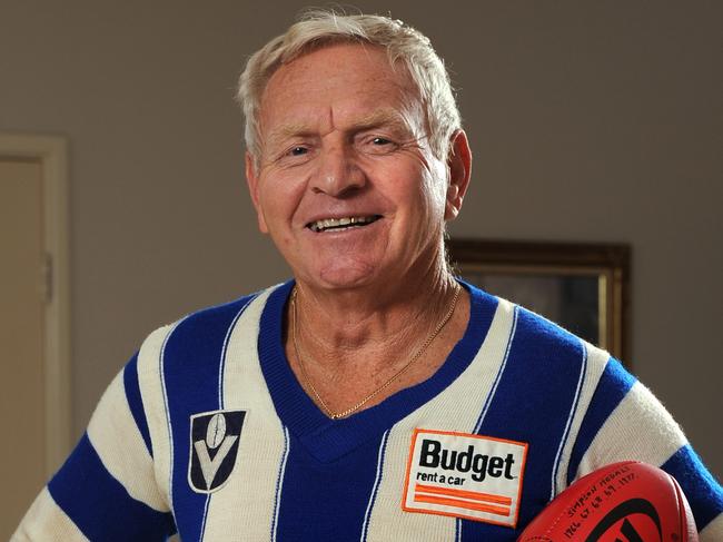 Barry Cable has been elevated to legend status in the AFL Hall Of Fame. Here at home he proudly dons one of his old North Melbourne jumpers.