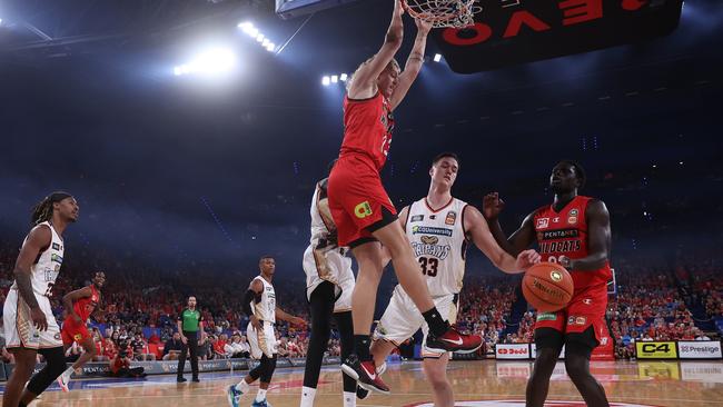 Luke Travers of the Wildcats dunks the ball on Taipans’ Stephen Zimmerman. (Photo by Paul Kane/Getty Images)