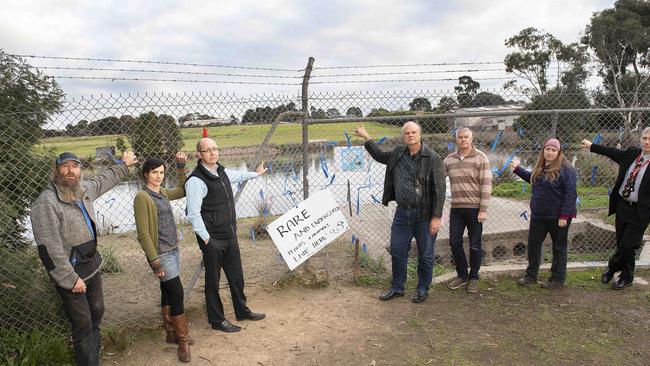 The community is rallying to save Lake Knox, with residents Darren Wallace, Jude Dwight, Anthony Bigelow, Mark Glazebrook, David Leiper, Melissa Allen and Richard Faragher campaigning for it to be saved. Picture: Ellen Smith