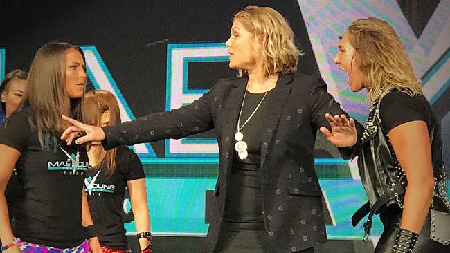 Savage: Rhea Ripley, right, gets in the face of opponent Tegan Nox, left, and is held back by former WWE champion Beth Phoenix, centre. Picture: Jordan Alvarado.