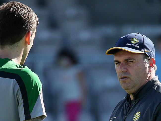 Socceroos training in Kogarah , 24th May, Sydney Australia. Socceroos coach Ange Postecoglou talks with Matthew Spiranovic Pic : George Salpigtidis