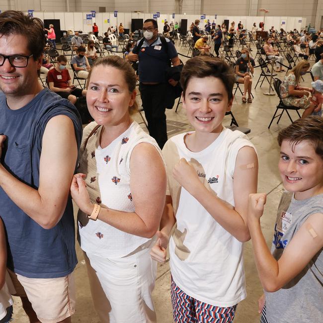 The Gomez family attend the Brisbane Convention and Exhibition Centre Vaccination Hub, South Brisbane to vaccinate their 12 and 14-year-old boys. Picture: Liam Kidston.