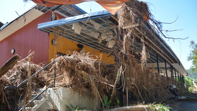 The remains of the Bana Yirriji Art and Cultural Centre and cafe at Wujal Wujal after the flood peaked on December 17. Picture: Bronwyn Farr