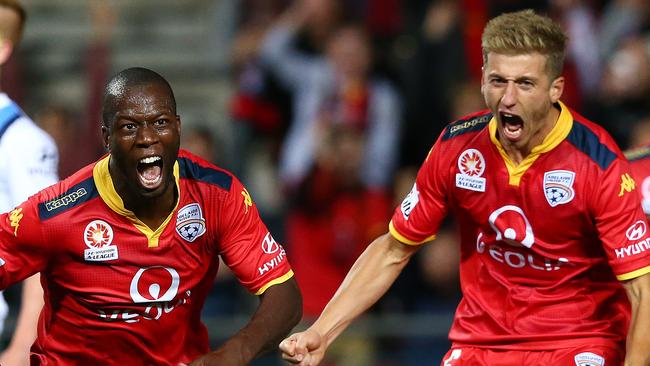 Bruce Djite and Stefan Mauk celebrate a goal in Adelaide United’s semi-final win over Melbourne City. They have now both departed for overseas teams. Picture: Sarah Reed