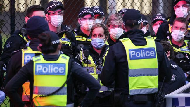 A heavy police presence was soon at the towers after the announcement of the lockdown. Picture: Ian Currie