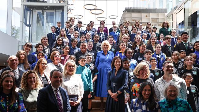 Queen Camilla (C) poses for a group photo with students, authors and representatives from the NSW Government during a visit to the Green Square Library. Picture: David Gray-Pool/Getty Images