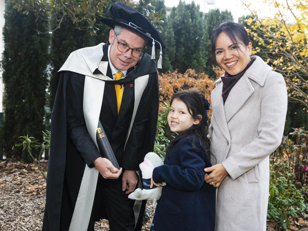 Doctor of Business Administration graduate Todd Rogers with daughter Lucy Rogers and wife Van Nguyen at a UniSQ graduation ceremony at The Empire, Tuesday, June 25, 2024. Picture: Kevin Farmer