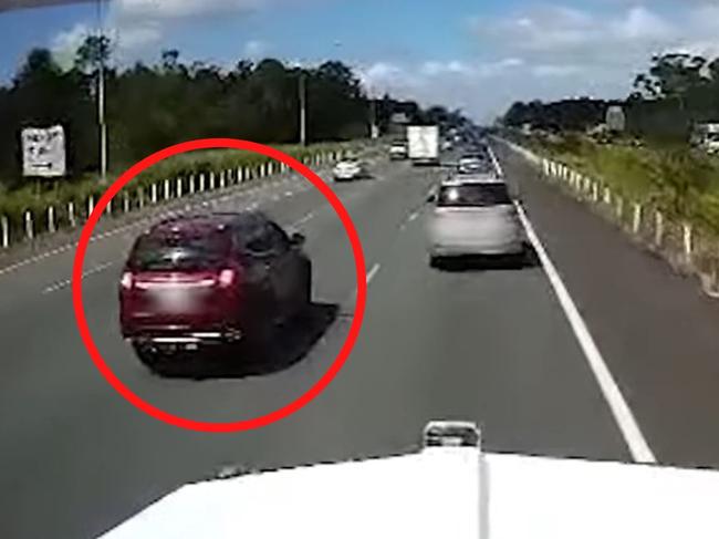 Shocking new footage has been released showing the very close call between a car and truck on a Queensland highway. Picture: Supplied