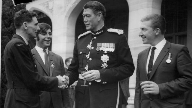 NSW governor Sir Roden Cutler, third left, congratulates Kevin Wickerson, left, Norden and William Young.