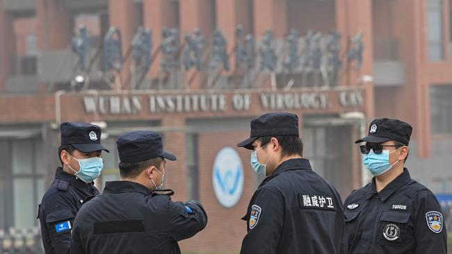 Security personnel stand guard outside the Wuhan Institute of Virology. Picture: AFP