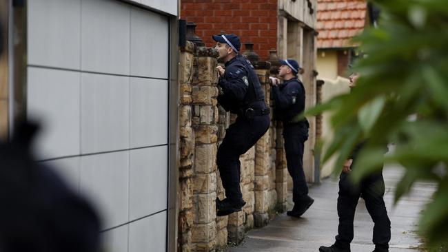 The operation involving approximately 50 officers from Raptor Squad, State Intelligence Command, Traffic and Highway Patrol, Aviation Command, Marine Area Command, and the Dog Squad. Picture: Jonathan Ng