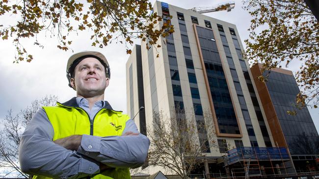 Construction project manager Sam Pearse from Marshall &amp; Brougham Constructions in front of the TRYP by Wyndham complex. Picture: Mark Brake