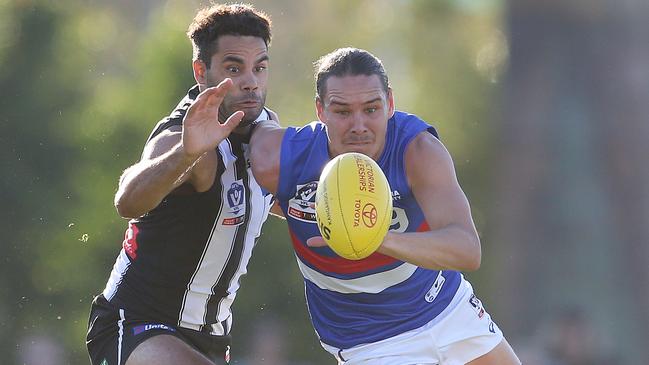 Daniel Wells and Lukas Webb battle for the ball. Picture: Michael Klein.