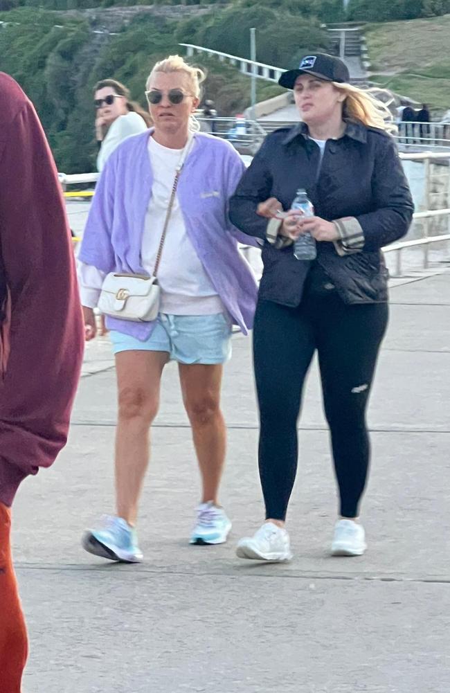 Rebel Wilson and partner Ramona Agruma walking at Bondi Beach on Monday.