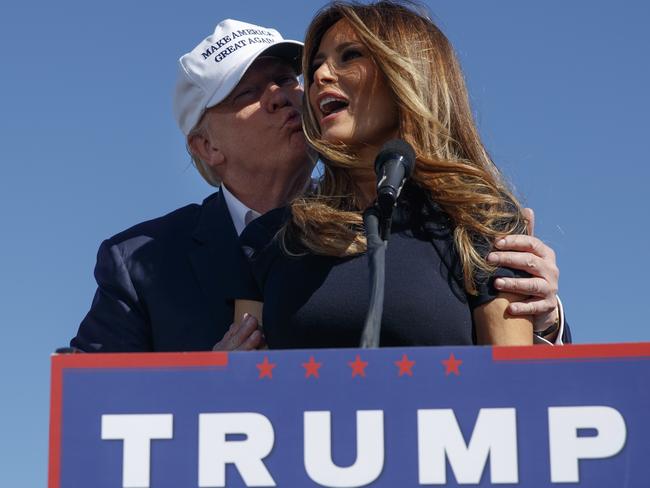 Republican presidential candidate Donald Trump kisses his wife, Melania, during a campaign rally. Picture: AP Photo/ Evan Vucci