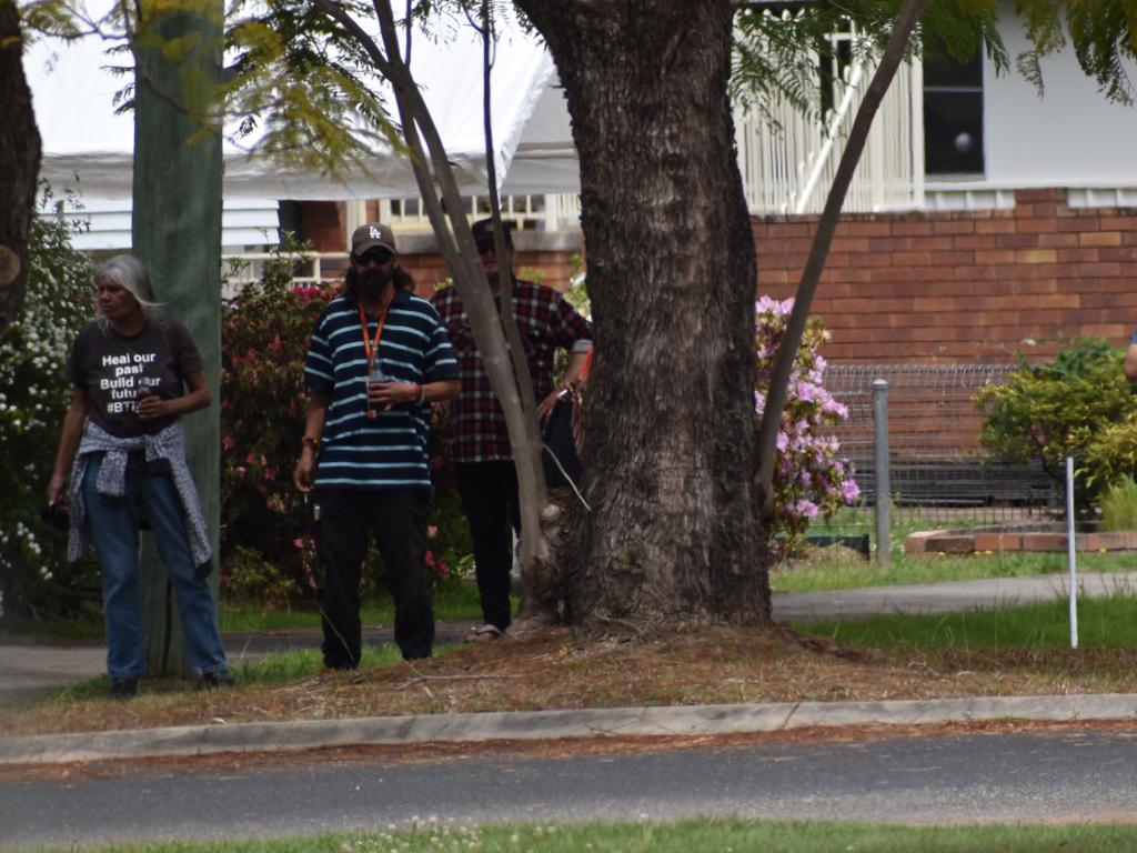 Residents watch on as police attempt to diffuse a situation involving a man at a Turf St property in Grafton on Sunday, 20th September, 2020.