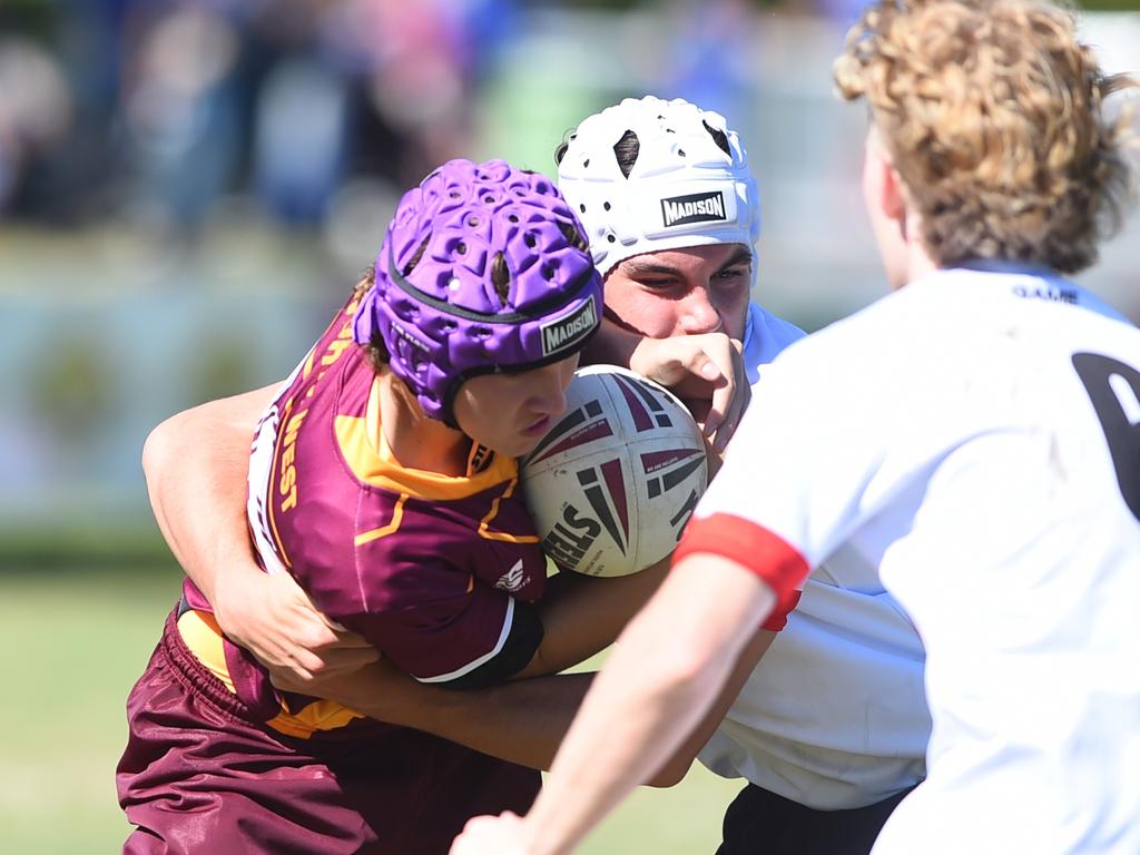 Boys Rugby League State Championship held at Northern Division, Brothers Leagues ground, Townsville. Northwest (maroon) v Wide Bay (white) 14-15 years. Jakeb Sladden of Hughenden SHS