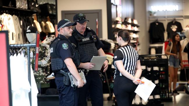 Police at the Rundle Mall Foot Locker store after thieves allegedly threatened staff with a hatchet. Picture: Kelly Barnes