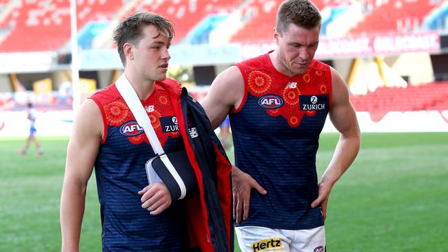 Sparrow walks off with an injury after the loss of the round 13 AFL match between the Western Bulldogs and the Melbourne Demons at Metricon Stadium. (Photo by Jono Searle/AFL Photos/via Getty Images)