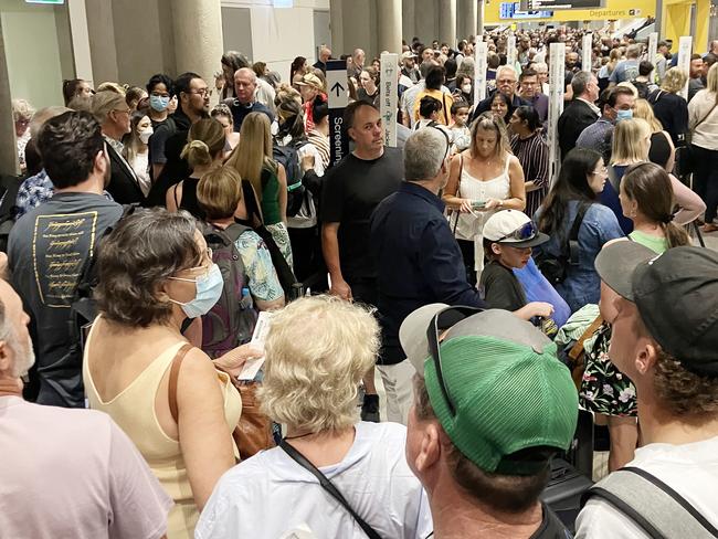 Line for passengers to go through security at the Brisbane Domestic Airport. Photo - Kieran Pelly