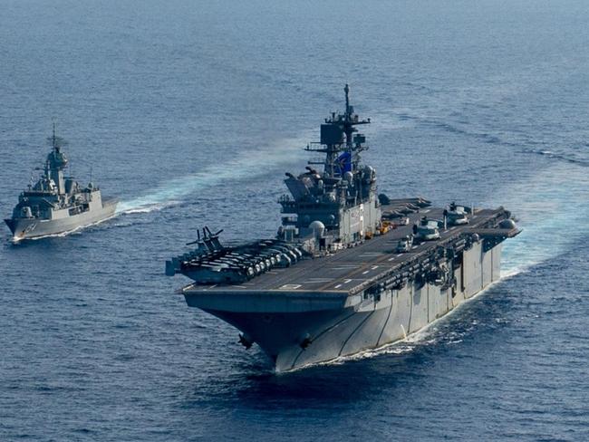 (L-R) Royal Australian Navy helicopter frigate HMAS Parramatta conducts officer of the watch manoeuvres with amphibious assault ship USS America, guided-missile cruiser USS Bunker Hill and guided-missile destroyer USS Barry in the South China Sea. *** Local Caption *** Royal Australian Navy Anzac class frigate HMAS Parramatta and her crew of 190 officers and sailors departed Fleet Base East in February for a deployment to South East Asia.  The deployment is a valuable opportunity to build relationships with Australia's regional partners and demonstrate the professionalism and capability of Navy and its people. Picture: Department of Defence