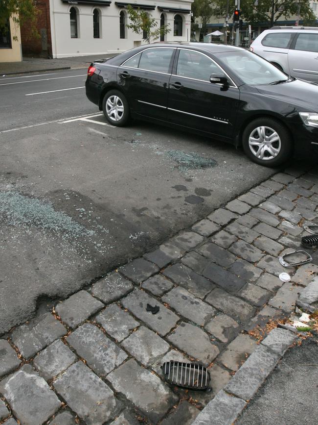 Debris on the road after Gobbo’s BMW was firebombed. 