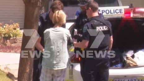 Anna Maria Di Pinto, centre, with SA Police following the alleged incident. Picture: 7NEWS