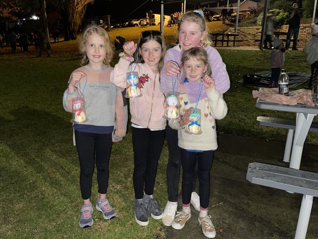 Friends Isabella Dunn (8), Shyla Smith (8), Mylee Smith (12) and Addalyn Sweet (8) show off their winter lanterns at Snowflakes in Stanthorpe 2021. Photo: Madison Mifsud-Ure / Stanthorpe Border Post