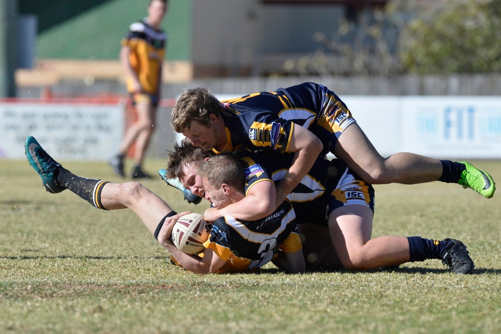 Gatton player Jayden Williams is tackled by Highfields in TRL President's Cup reserve grade rugby league at Herb Steinohrt oval, Sunday, June 17, 2018. Picture: Kevin Farmer