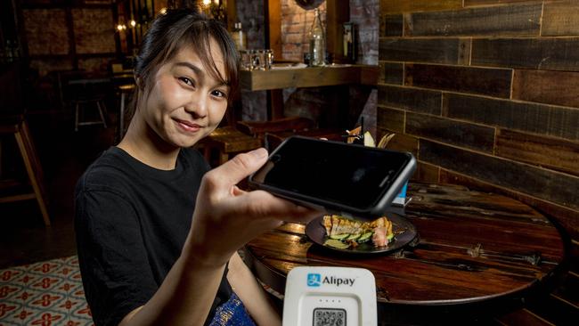 IncentiaPay is banking on the Alipay rollout to deliver growth for the business. Nopphaket Maleenant pays for her meal at Chong Co Thai Pacific Fair with Alipay. Picture: Jerad Williams