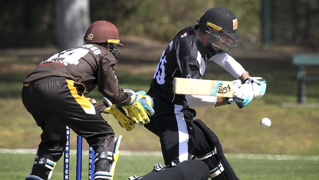 Grade cricket match between Kensington and Adelaide University at Parkinson Oval (Kensington Gardens Reserve). Adelaide Uni's Will Bosisto in action with Kensington wicket keeper Van Der Jeugd. 9 November 2019. (Dean Martin/AAP Image).