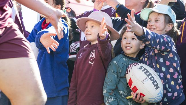 Greeting players as they run out are (from left) Rosie Devlin, Jackson Gibbs and Eleanor McGregor at the Queensland Maroons fan day at Toowoomba Sports Ground, Tuesday, June 18, 2024. Picture: Kevin Farmer