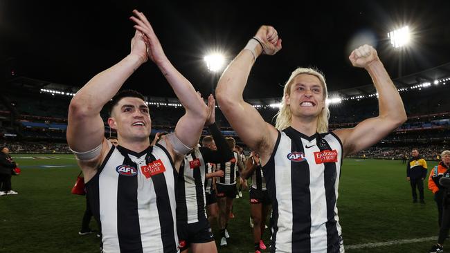 The Pies celebrate the big win. Photo by Michael Klein.