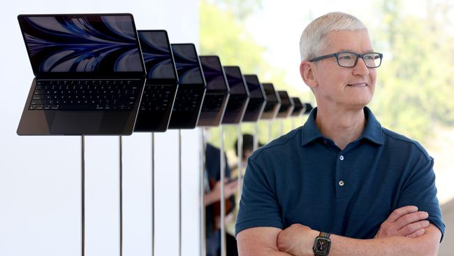 Apple chief executive Tim Cook with the new redesigned MacBook Air laptops at Apple Park in June. Picture: AFP