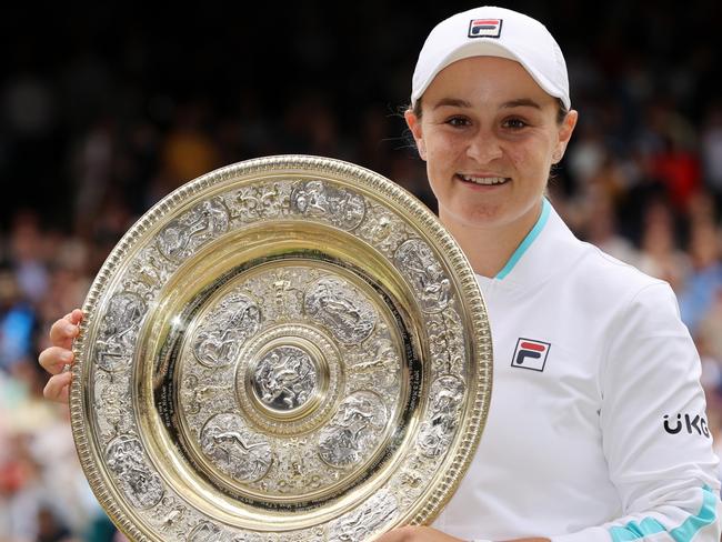 MARCH 23, 2022: World number 1 and three-time Grand Slam winner Ash Barty has announced her retirement from tennis at the age of 25. LONDON, ENGLAND - JULY 10: Ashleigh Barty of Australia celebrates with the Venus Rosewater Dish trophy after winning her Ladies' Singles Final match against Karolina Pliskova of The Czech Republic  on Day Twelve of The Championships - Wimbledon 2021 at All England Lawn Tennis and Croquet Club on July 10, 2021 in London, England. (Photo by Clive Brunskill/Getty Images)