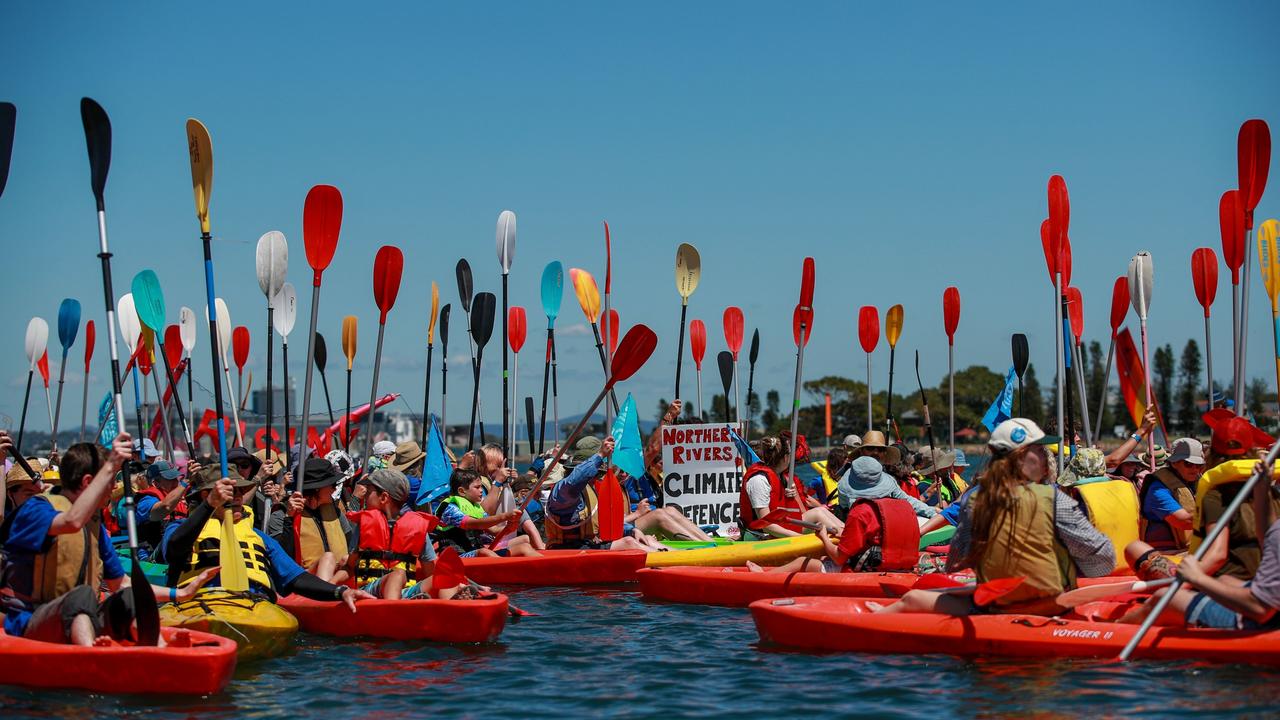 Protesters create a blockade at the world’s largest coal port in Newcastle, aiming for the country’s biggest peaceful demonstration for climate action at Horseshoe Beach. Picture: Roni Bintang/Getty Images