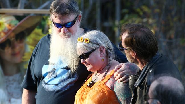 Friends and family members of Toyah Cordingley gather at her memorial at Wangetti Beach to commemorate the second anniversary of her death. Snake Gardiner supports Toyah's mother Vanessa Gardiner and Wayne "Prong" Trimble as they speak to the crowd gathered at the memorial. PICTURE: BRENDAN RADKE