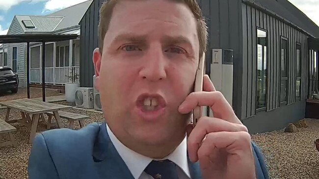 Ray White real estate agent Aaron Hill inspects one of the CCTV cameras installed at the Gisborne property. Picture: Supplied