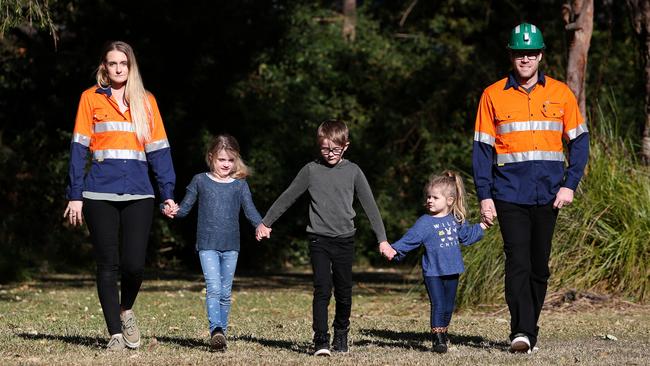 Dane and Sarah-Jane Sharp with their children Aleksandar, 7, Olivia, 6, and Elowyn, 3. Picture: Peter Lorimer.