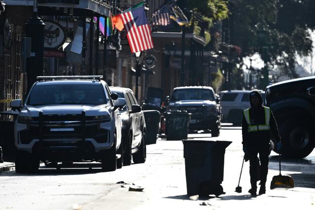 A city worker cleans in New Orleans after the New Year's truck attack