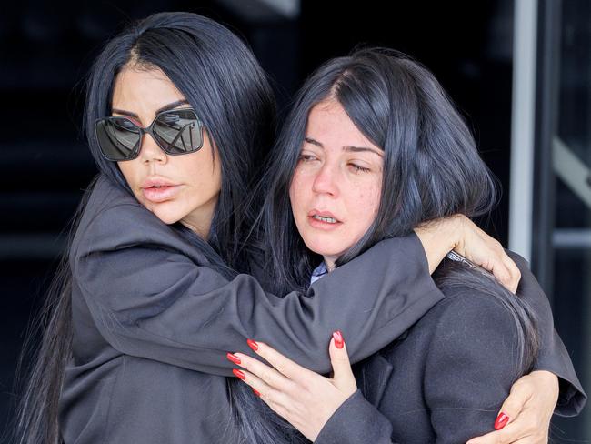 Mourners weep outside the service. Picture: David Geraghty