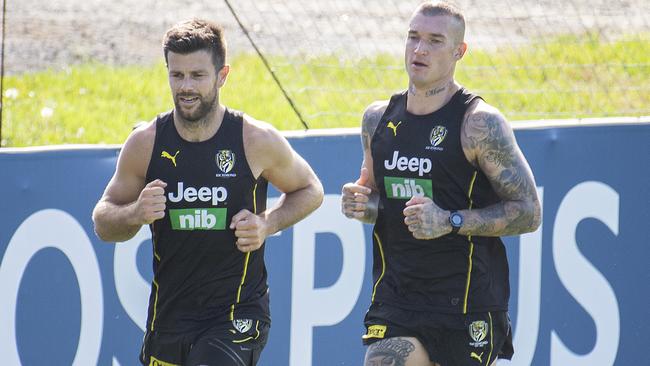 Trent Cotchin runs laps with Dustin Martin.