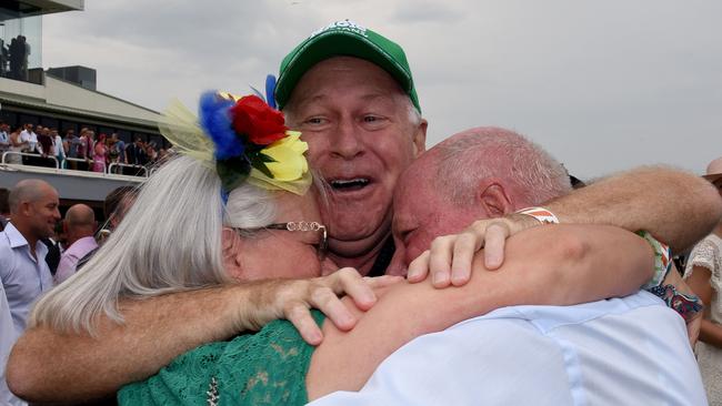 Allan Endresz, with Robyn and Jeff Simpson celebrate Alligator Blood’s win, which was subsequently taken off him.