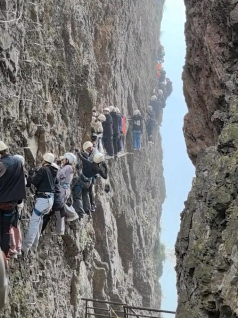 Tourists stuck climbing a mountainside at Yandang Mountain, China. Picture: AsiaWire.