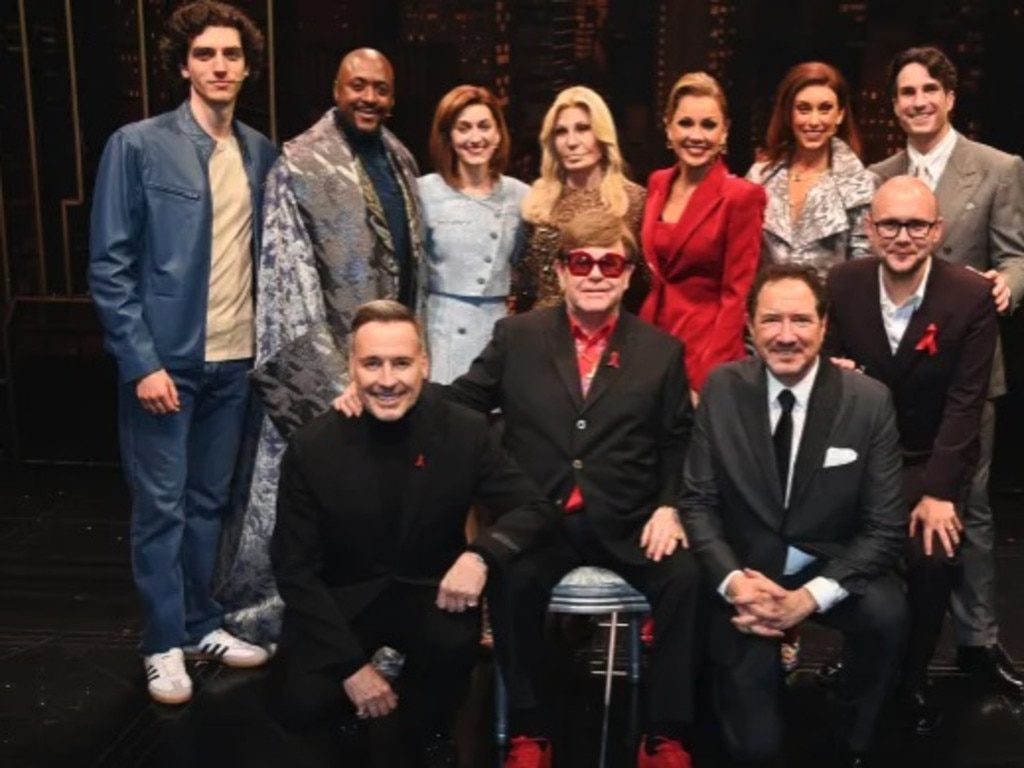 Elton joined the cast - led by Vanessa Williams (pictured in red) for the occasion. Picture: Getty