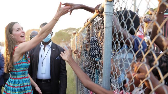 Kate Middleton shaking hands with fenced off children in Jamaica incites rage. Picture: Chris Jackson-Pool/Getty Images.