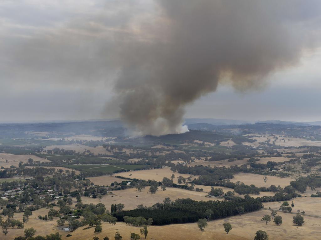 The bushfire claimed more than 80 homes and left businesses in ruin. Picture: Naomi Jellicoe