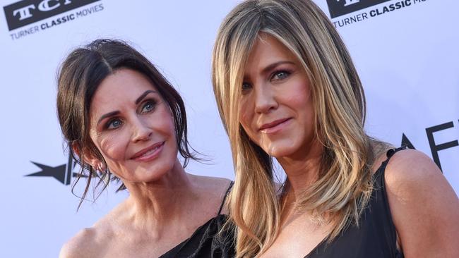 (FILES) In this file photo taken on June 7, 2018 US actresses Courteney Cox (L) and Jennifer Aniston attends the 46th American Film Institute Life Achievement Award Gala at the Dolby Theatre in Hollywood. - Emmy nominations were announced on July 13, 2021 as television prepares to honor a year transformed by the pandemic. Courteney Cox was famously the one "Friends" star never nominated for an Emmy during the wildly popular sitcom's original run. Voters finally remedied that -- to an extent -- that by nominating the much-maligned "Friends: The Reunion," on which Cox served as an executive producer, for four awards including best pre-recorded variety special. (Photo by VALERIE MACON / AFP)