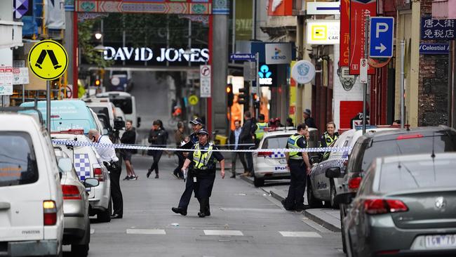 Police cordoned off Little Bourke St after a passer-by made the grisly discovery.